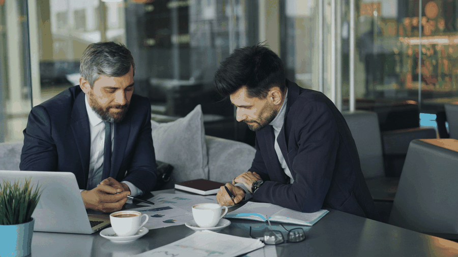business challenges, financial stress, spreadsheet complexity, team meeting discussion